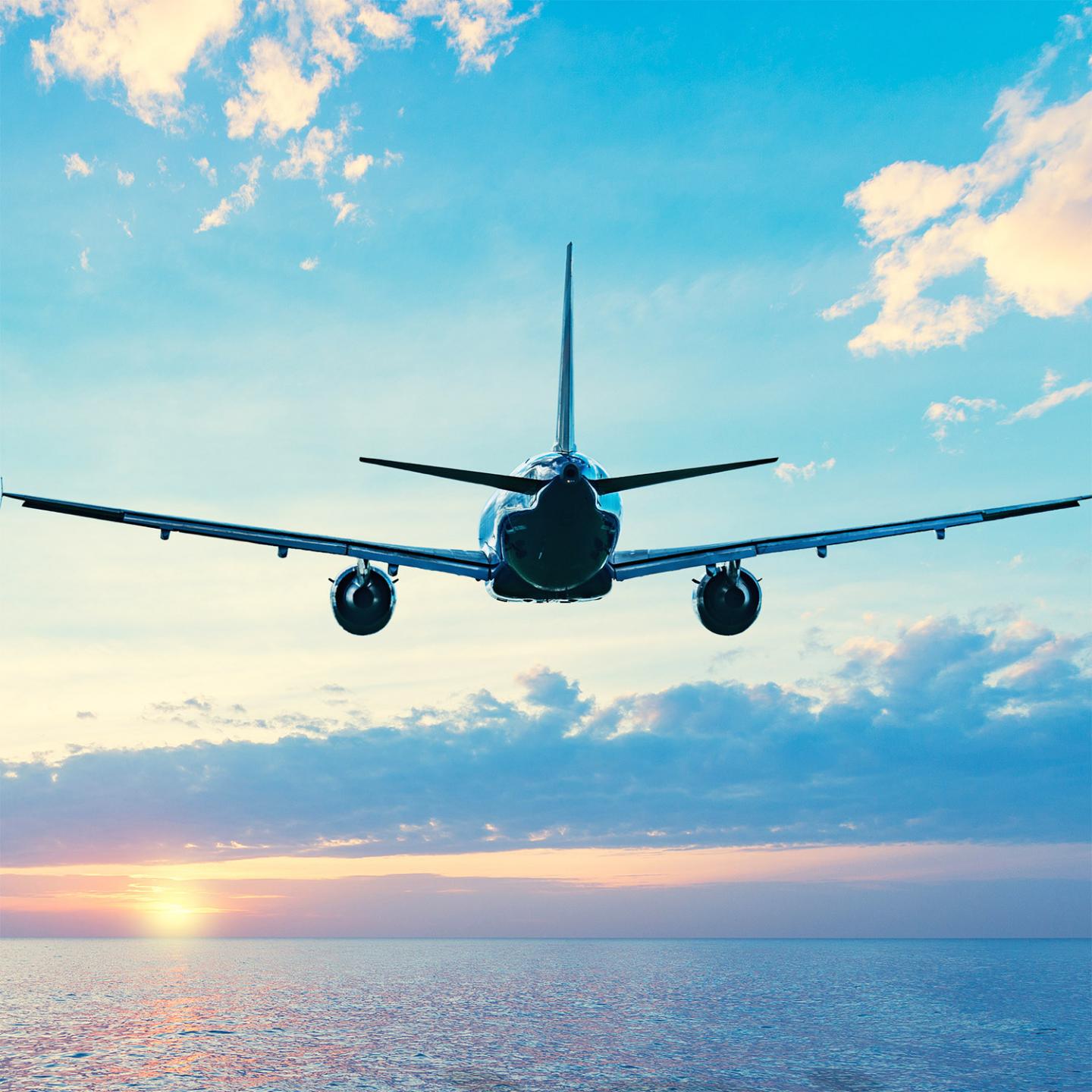 Plane flying over ocean